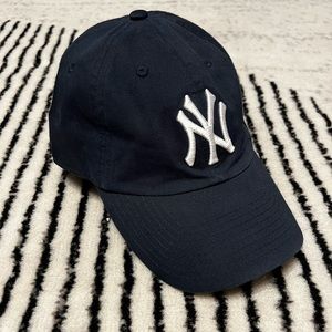 NY Yankees baseball cap adjustable closure. Navy blue and white. Worn on…
